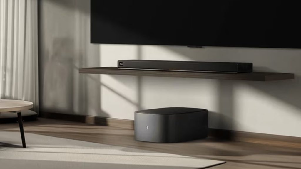 LG Sound Suite H7 soundbar under a TV with the W7 wireless subwoofer on the floor