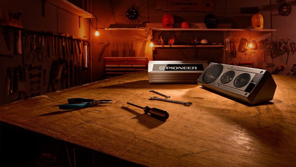 Pioneer Heritage Collection SXT-C10PS retro head unit and TS-X40SXT box speaker on a workshop bench